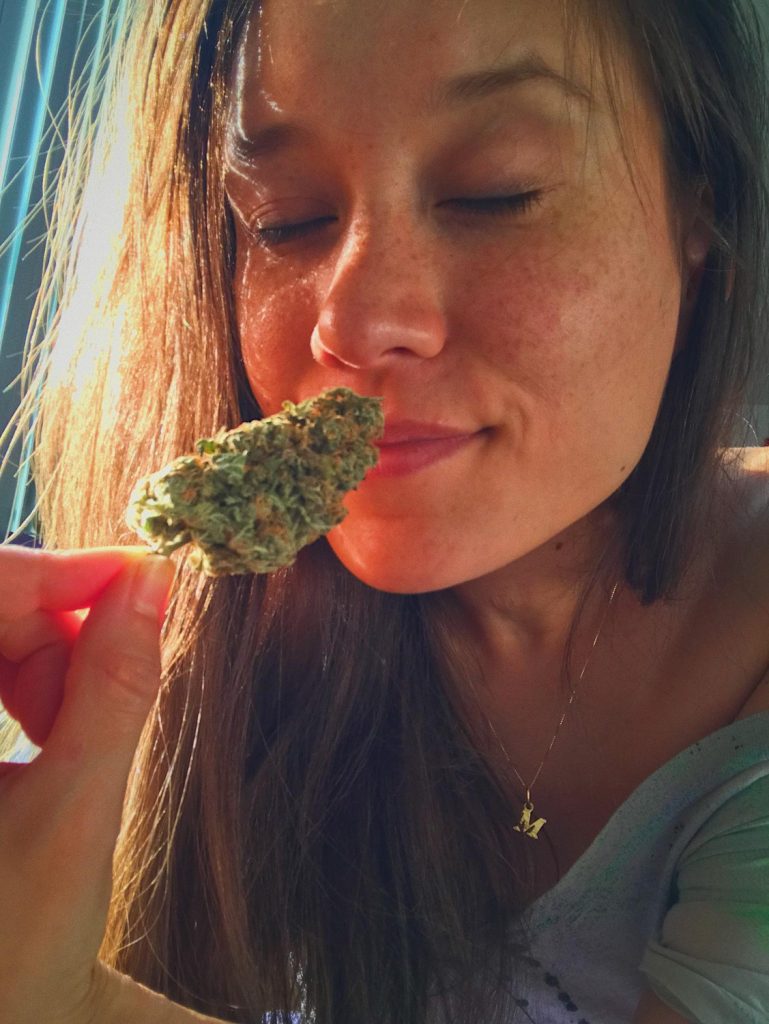 Girl Smelling THCA Flower