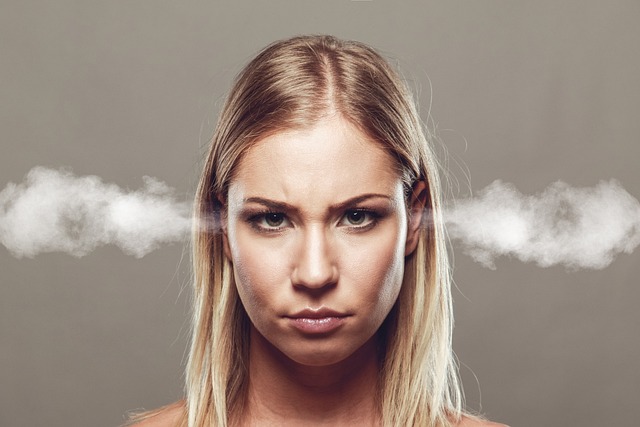 A frustrated woman with smoke coming out of her ears