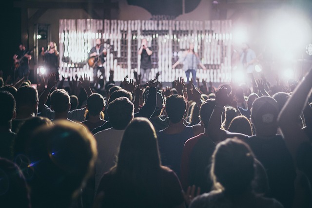 A crowd of people watching a live concert performance