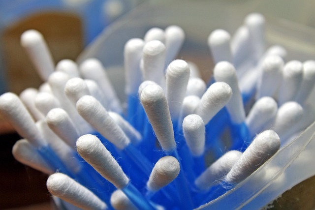 A close-up view of blue cotton swabs in a container